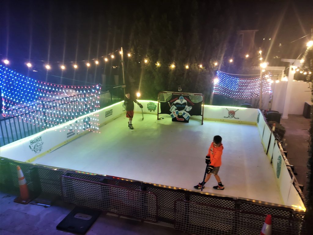 Backyard skating rink under the stars, powered by Skate Anytime Synthetic Ice