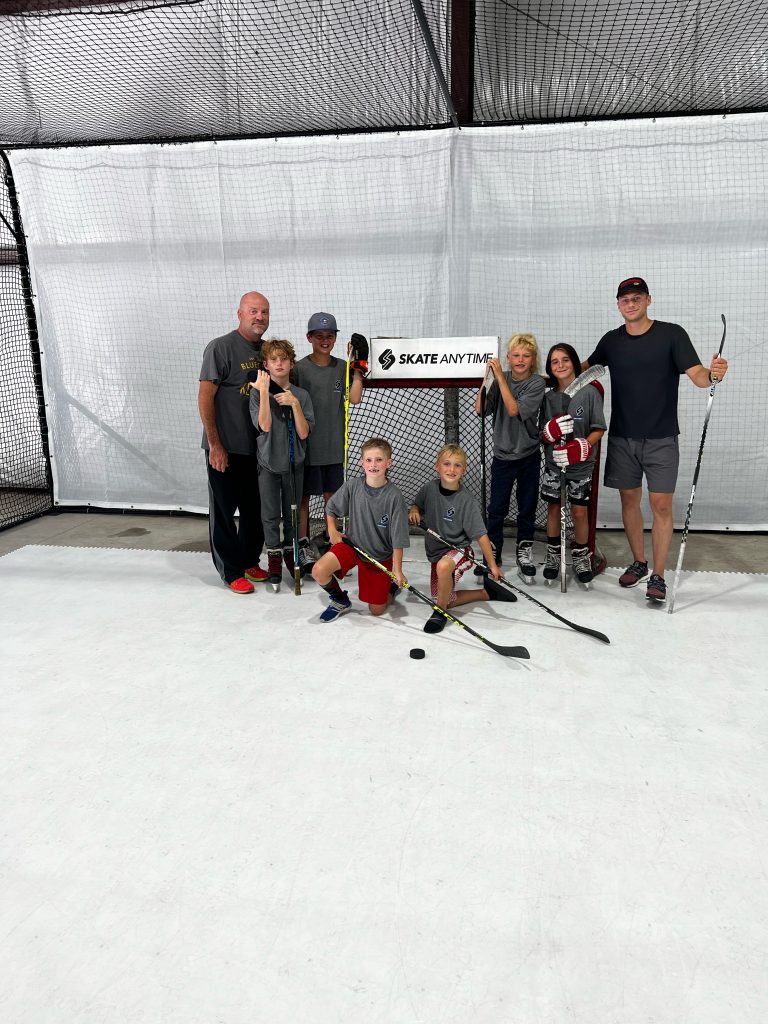 Hockey training center student practicing on Skate Anytime synthetic ice panels.