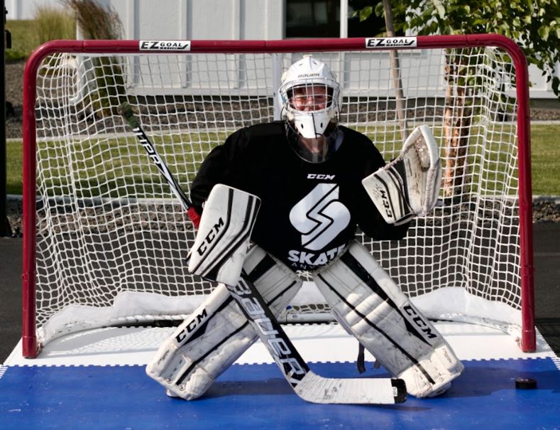 Goalie training on synthetic ice for year-round hockey practice
