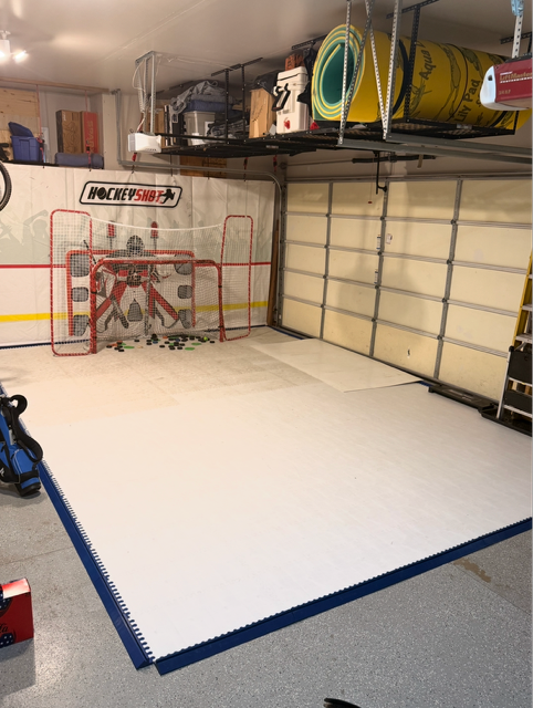 Garage hockey training area with synthetic ice surface